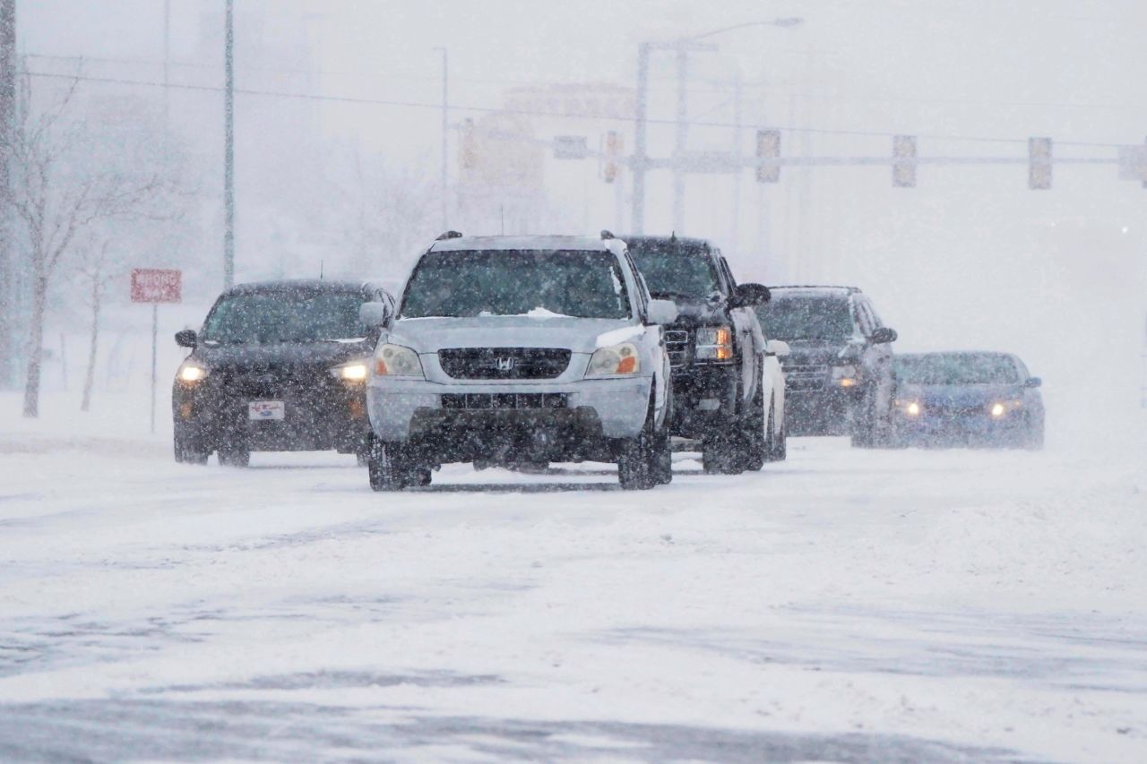 Drivers make their way along a road during a winter storm Sunday, February 14, in Oklahoma City. 