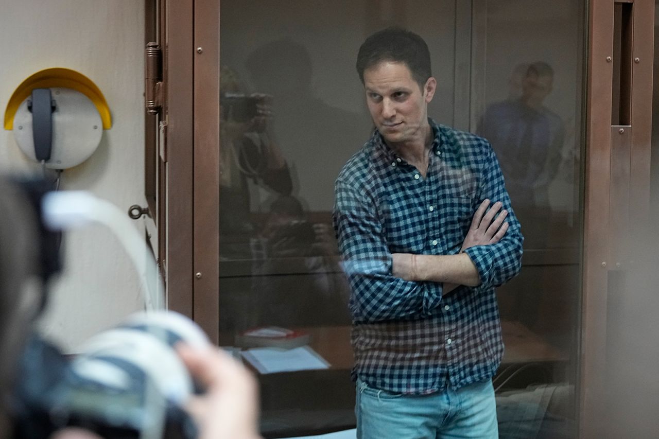 Wall Street Journal reporter Evan Gershkovich stands in a glass cage in a courtroom at the Moscow City Court, in Moscow, Russia, on Tuesday, April 18.