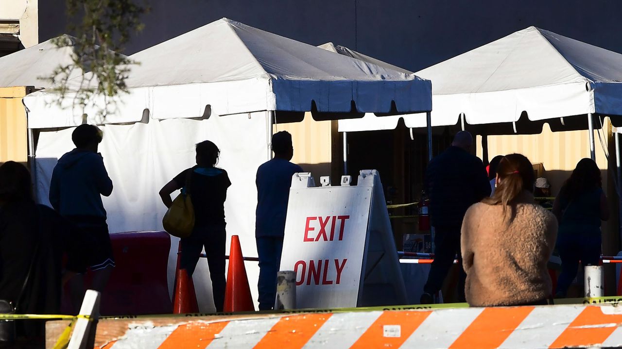 People wait in line to get a Covid-19 test at a testing center in Los Angeles, California on December 16. 