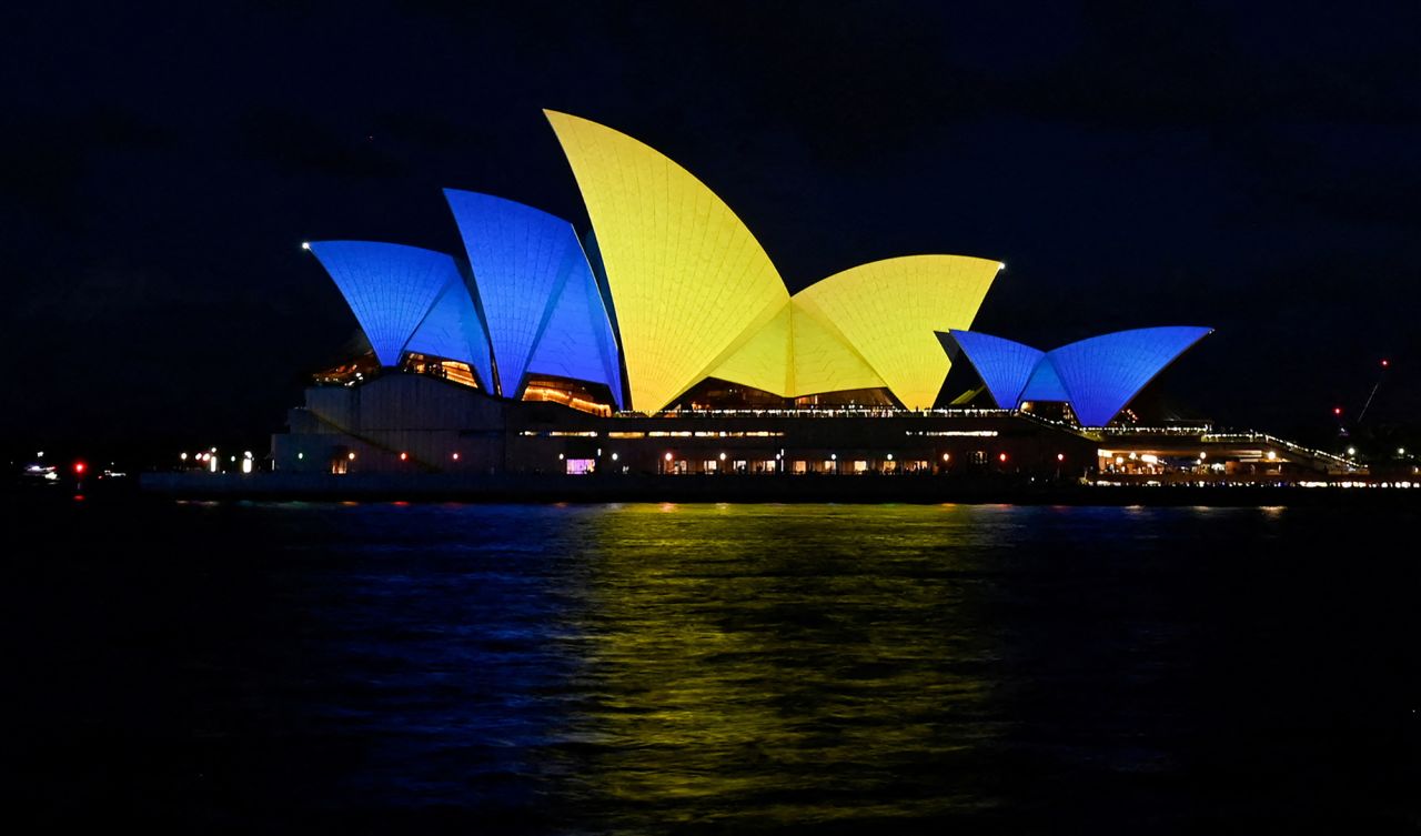 The sails of the Sydney Opera House are illuminated with the colours of the Ukrainian Flag to mark one year since Russia's invasion of Ukraine began, in Sydney, Australia, on February 24.