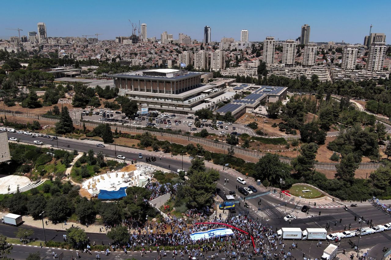 An aerial view shows protesters holding an Israeli flag during a demonstration near the Knesset in Jersusalem on Monday.