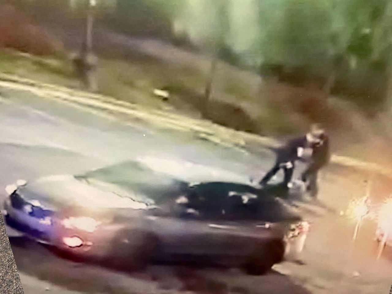 This image, presented by the office of the Fulton County District Attorney, shows Officer Devin Brosnan standing on Rayshard Brooks. Brosnan faces an aggravated assault charge.