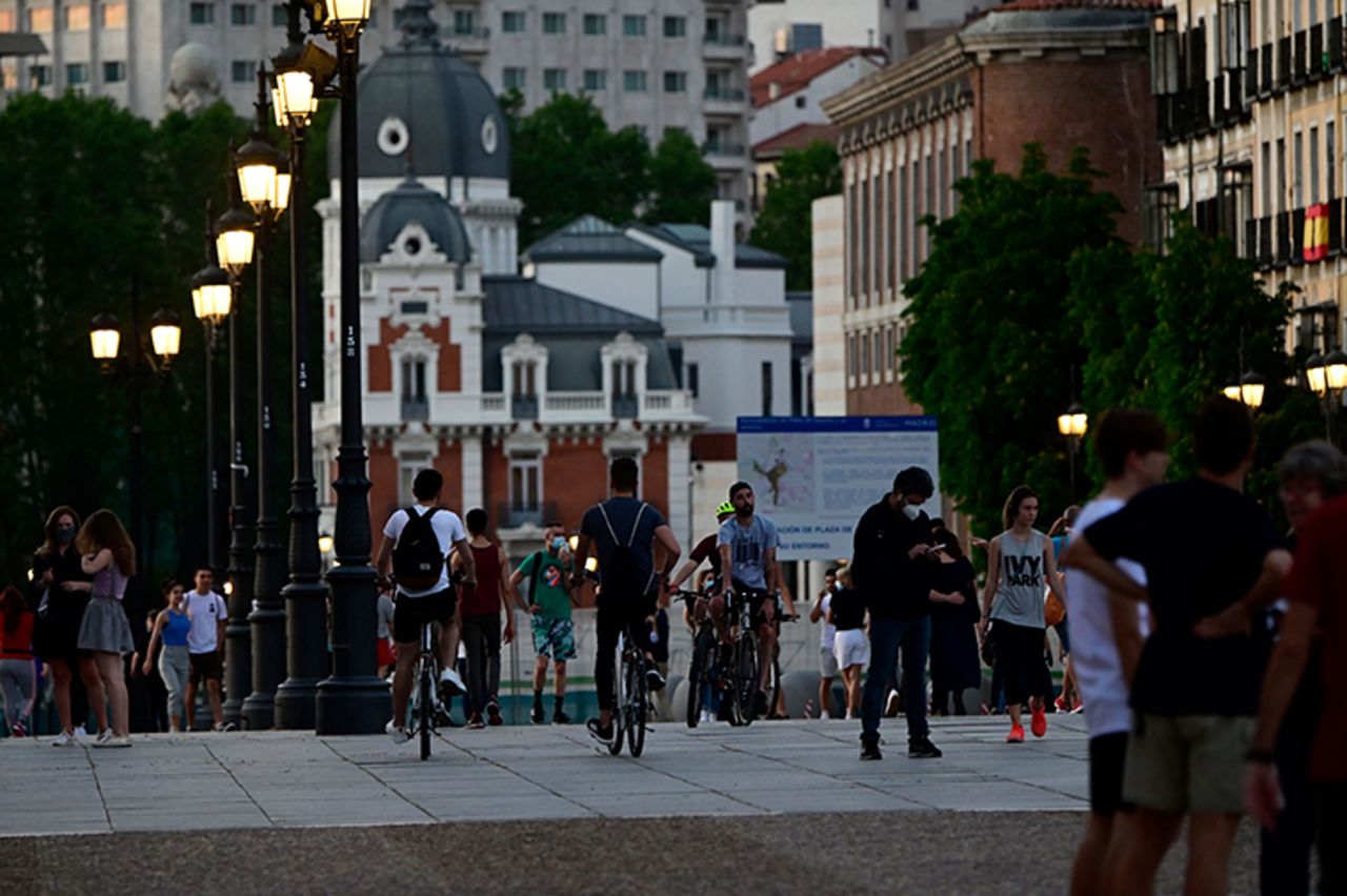 People walk in Madrid, on Friday, May 8.