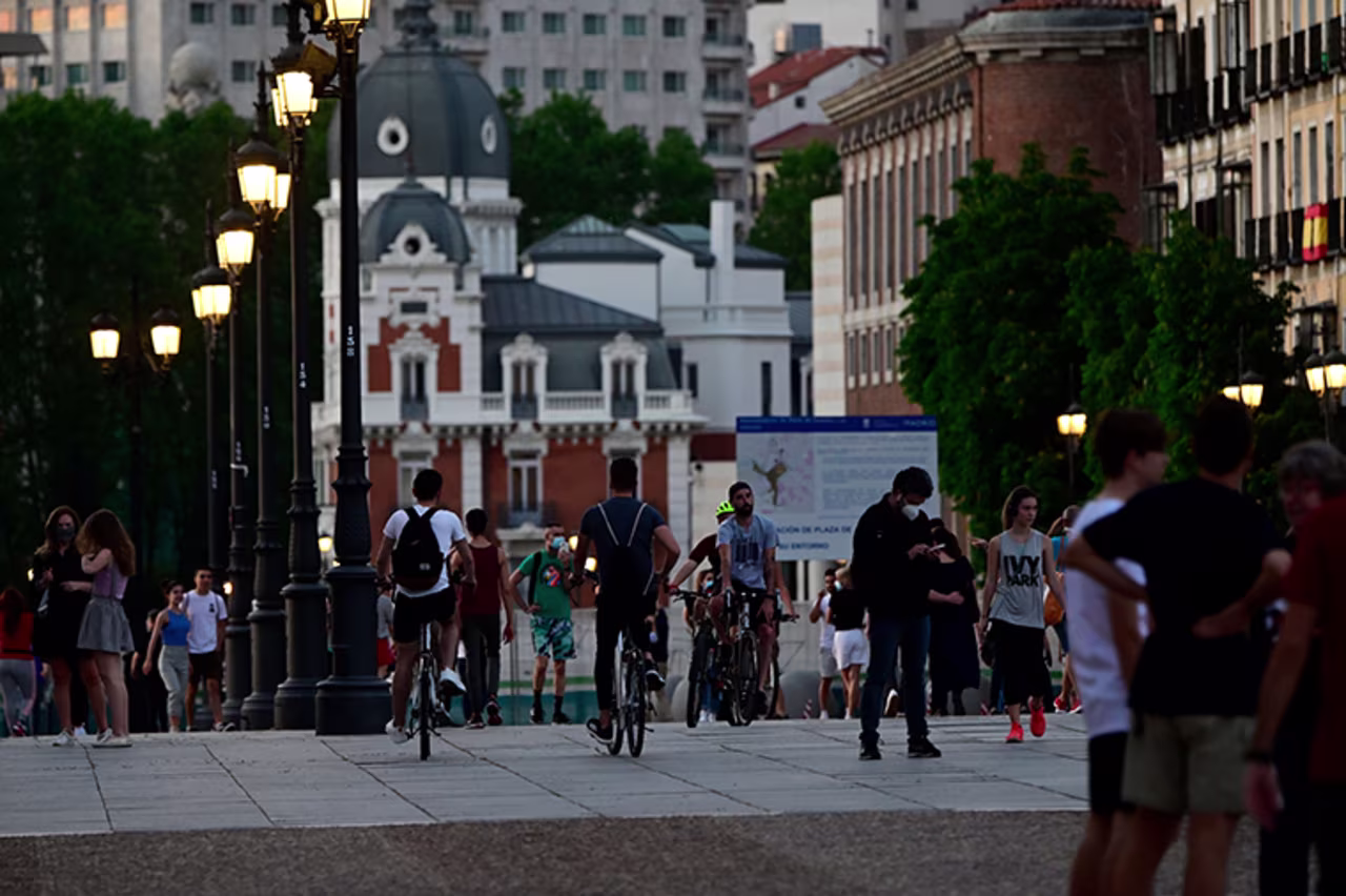People walk in Madrid, on Friday, May 8.