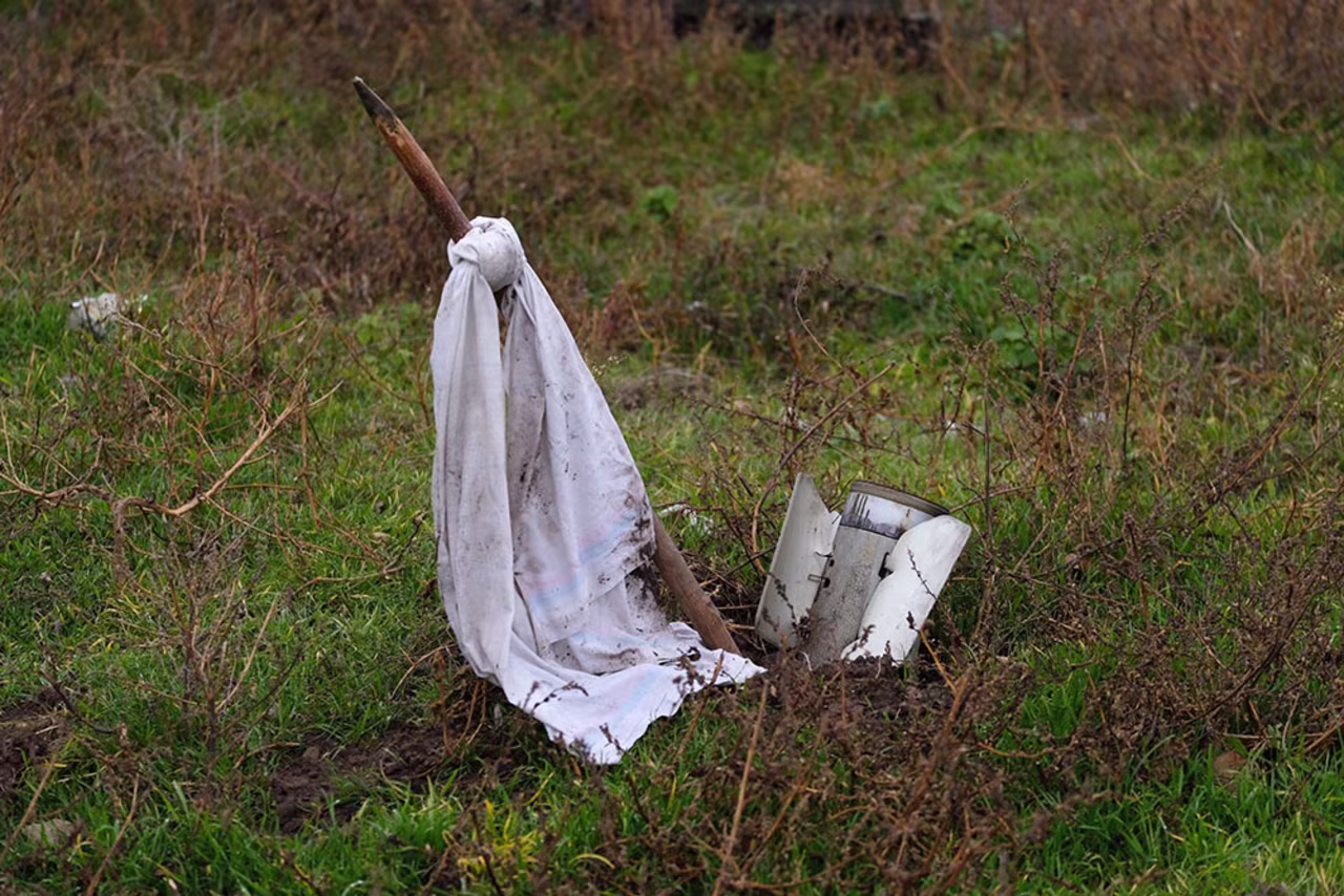 A white flag marks an unexploded missile.