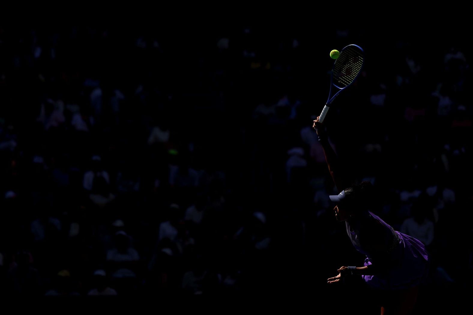 Naomi Osaka serves during a third-round match at the US Open on Saturday, August 30.