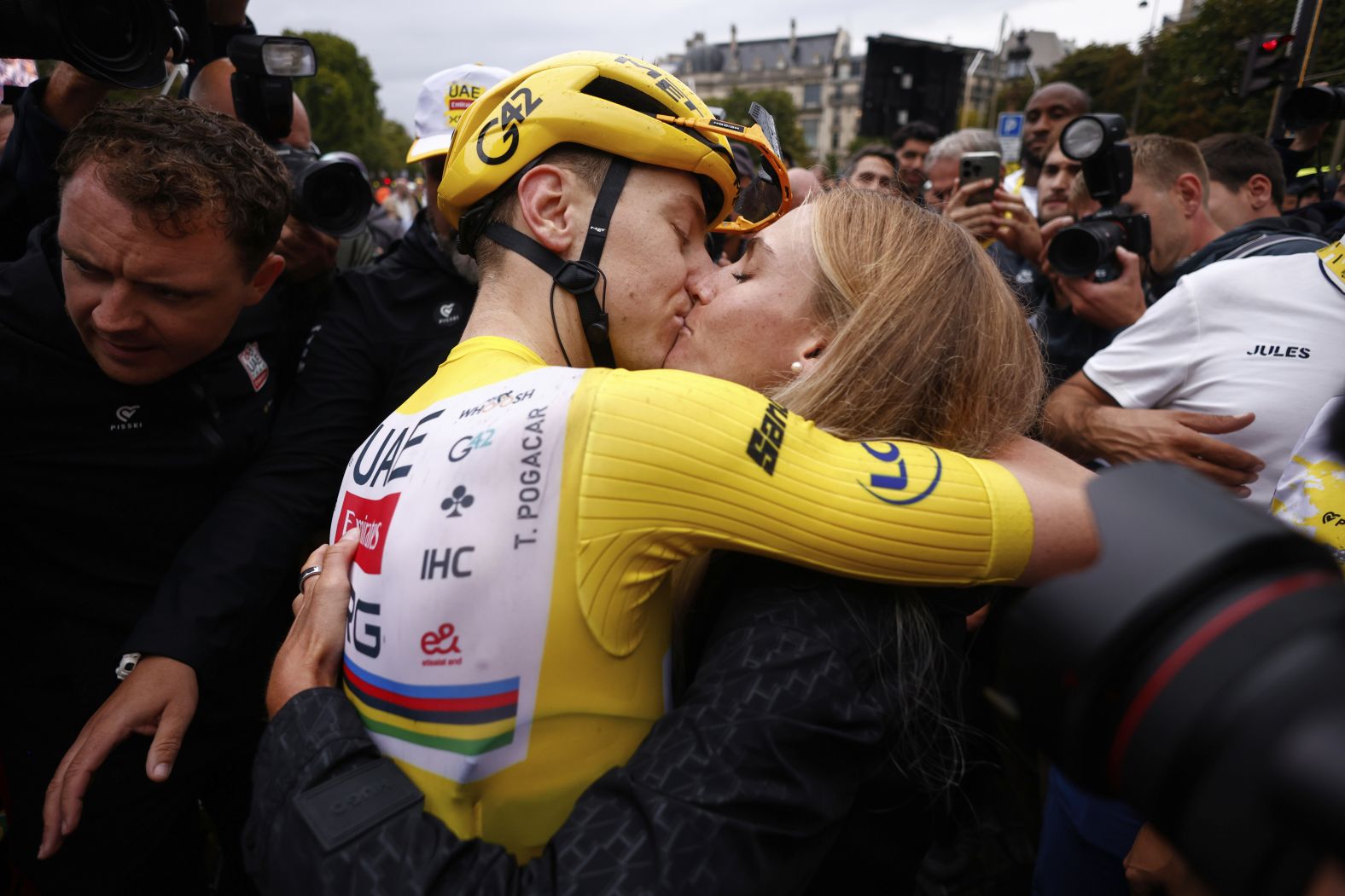 Tour de France winner Tadej Pogačar kisses his partner, Urska Zigart, after finishing the final stage of the race on Sunday, July 27. <a href="index.php?page=&url=https%3A%2F%2Fwww.cnn.com%2F2025%2F07%2F27%2Fsport%2Ftadej-pogacar-tour-de-france-fourth-win-spt">Pogačar has now won four Tour de France titles</a>, leaving him just one shy of tying the overall record.