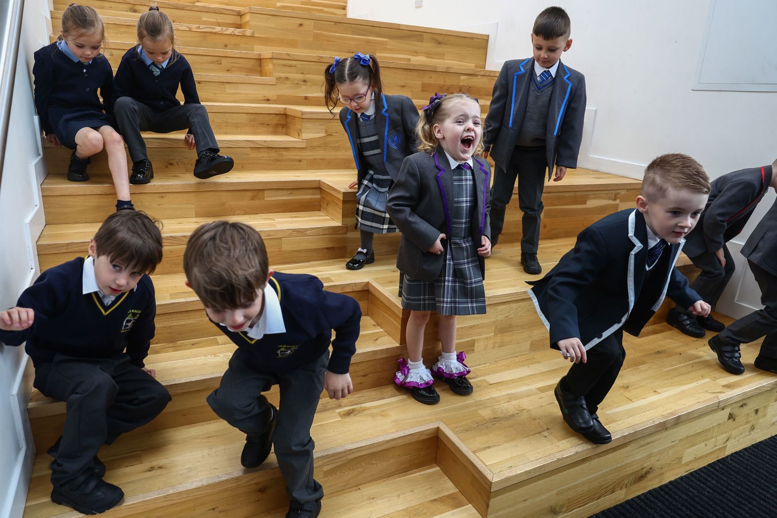 Evie McGowan reacts as she joins other twins about to start primary school in Greenock, Scotland, on Tuesday, August 13. The high twin birthrate in the Inverclyde council area <a  target="_blank">has earned it the nickname “Twinverclyde.”</a>