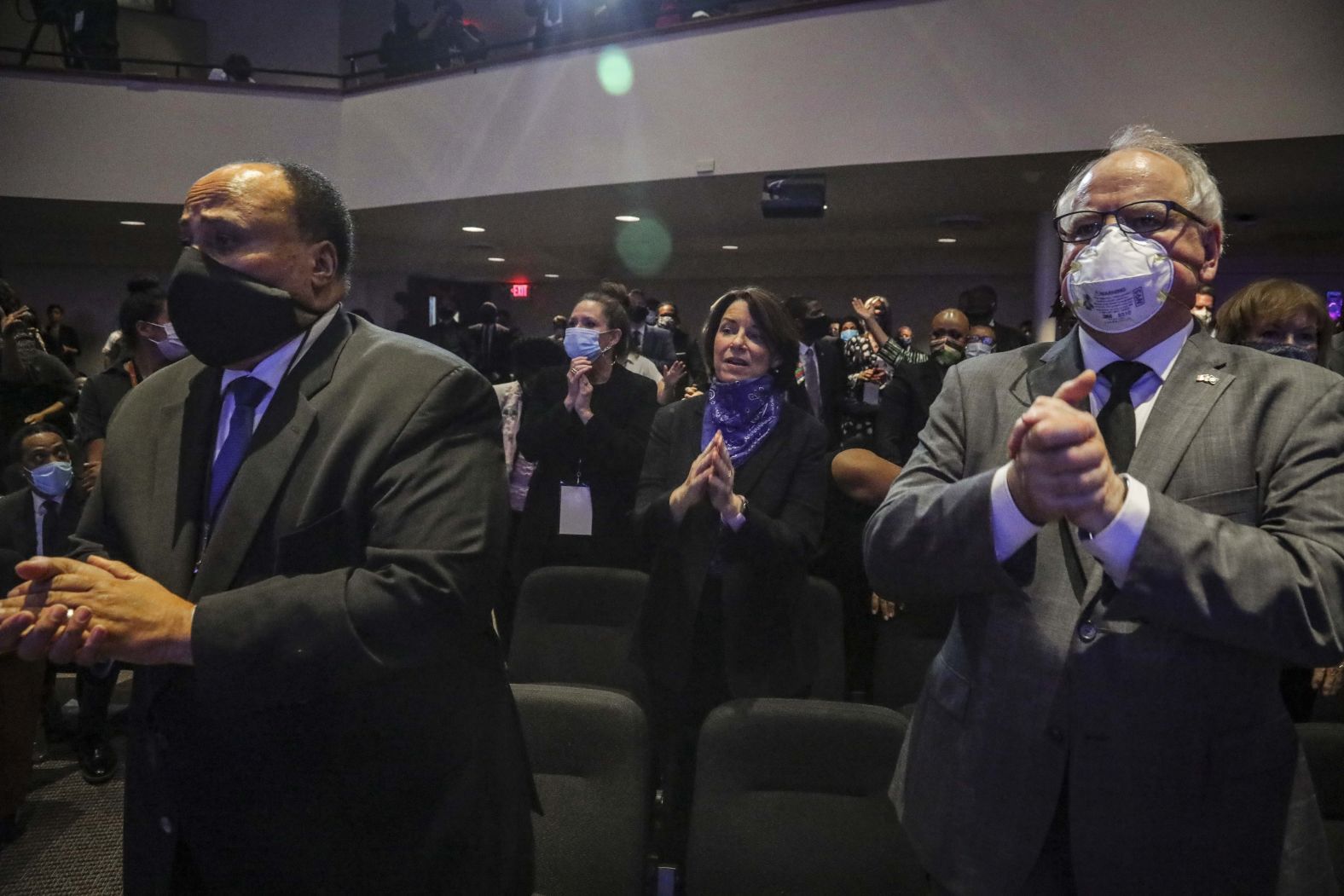 Walz attends a memorial service for George Floyd in Minneapolis in June 2020. At left is Martin Luther King III. Behind them is Minnesota Sen. Amy Klobuchar.