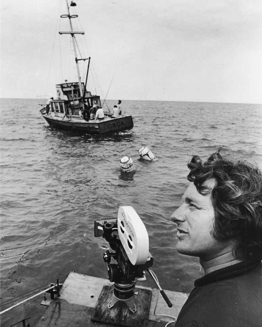 Spielberg prepares to shoot a boat scene in the Nantucket Sound off of Martha's Vineyard. The scenes shot in open water were some of the most challenging in the film, owing to choppy conditions and difficulty with the shark figures.