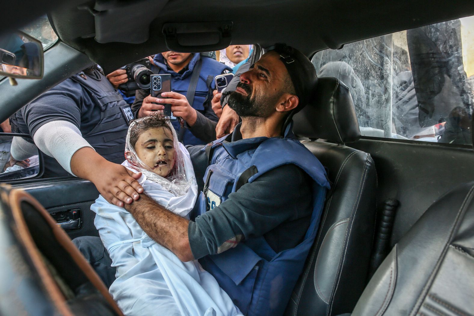 Photojournalist Mohammed Alaloul, who works for Turkey’s Anadolu Agency, carries the body of one of his children who was killed <a href="https://www.cnn.com/2023/11/05/middleeast/blast-at-al-maghazi-refugee-camp-in-central-gaza-kills-dozens/index.html">at the Al-Maghazi refugee camp</a> in central Gaza on November 5. Several of his family members, including four of his children, <a href="https://www.cnn.com/2023/11/05/middleeast/blast-at-al-maghazi-refugee-camp-in-central-gaza-kills-dozens/index.html">were killed</a>. “This isn’t uncommon, seeing journalists and photographers finding their dead children while working,” photographer Samar Abu Elouf said. “My biggest fear is finding myself in the position of the people I photograph, to be the one pictured mourning over my children’s bodies.”