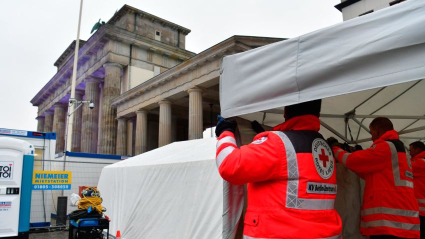 Red Cross workers set up an emergency tent in front of Berlin's landmark Brandenburg Gate where preparations are under way for New Year's Eve festivities on December 30, 2017. / AFP PHOTO / John MACDOUGALL        (Photo credit should read JOHN MACDOUGALL/AFP/Getty Images)