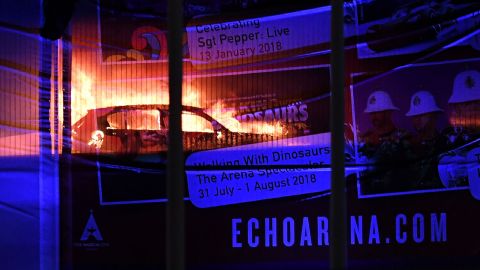 A massive blaze engulfs vehicles parked at a multi-storey car park near the Echo Arena, at the waterfront in Liverpool, England on Sunday afternoon. 