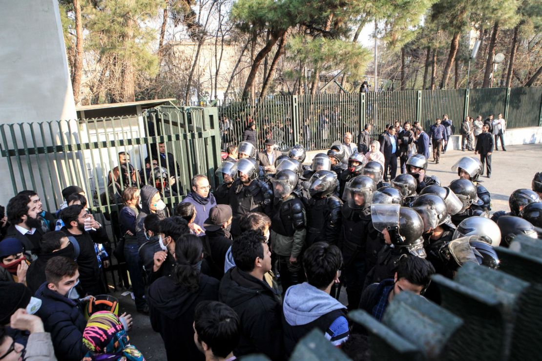 Iranian students scuffle with police at the University of Tehran.