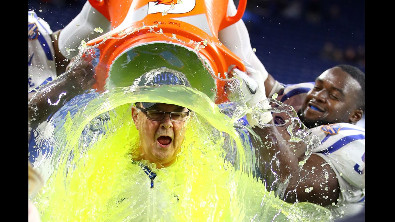 Duke head coach David Cutcliffe is doused with Gatorade after his team won the Quick Lane Bowl on Tuesday, December 26. The Blue Devils defeated Northern Illinois 36-14.