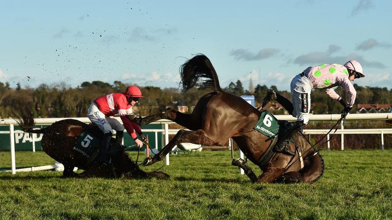 Jockey Patrick Mullins goes flying off Sharjah, right, as they crash over the final fence of a hurdle race in Dublin, Ireland, on Wednesday, December 27. The fall also took out Real Steel and jockey Paul Townend, left. <a target="_blank" target="_blank">According to the BBC,</a> all were reported to be fine following the crash.