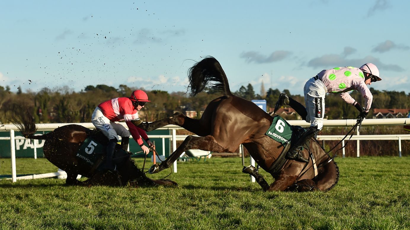 Jockey Patrick Mullins goes flying off Sharjah, right, as they crash over the final fence of a hurdle race in Dublin, Ireland, on Wednesday, December 27. The fall also took out Real Steel and jockey Paul Townend, left. <a href="http://www.bbc.com/sport/horse-racing/42496855" target="_blank" target="_blank">According to the BBC,</a> all were reported to be fine following the crash.