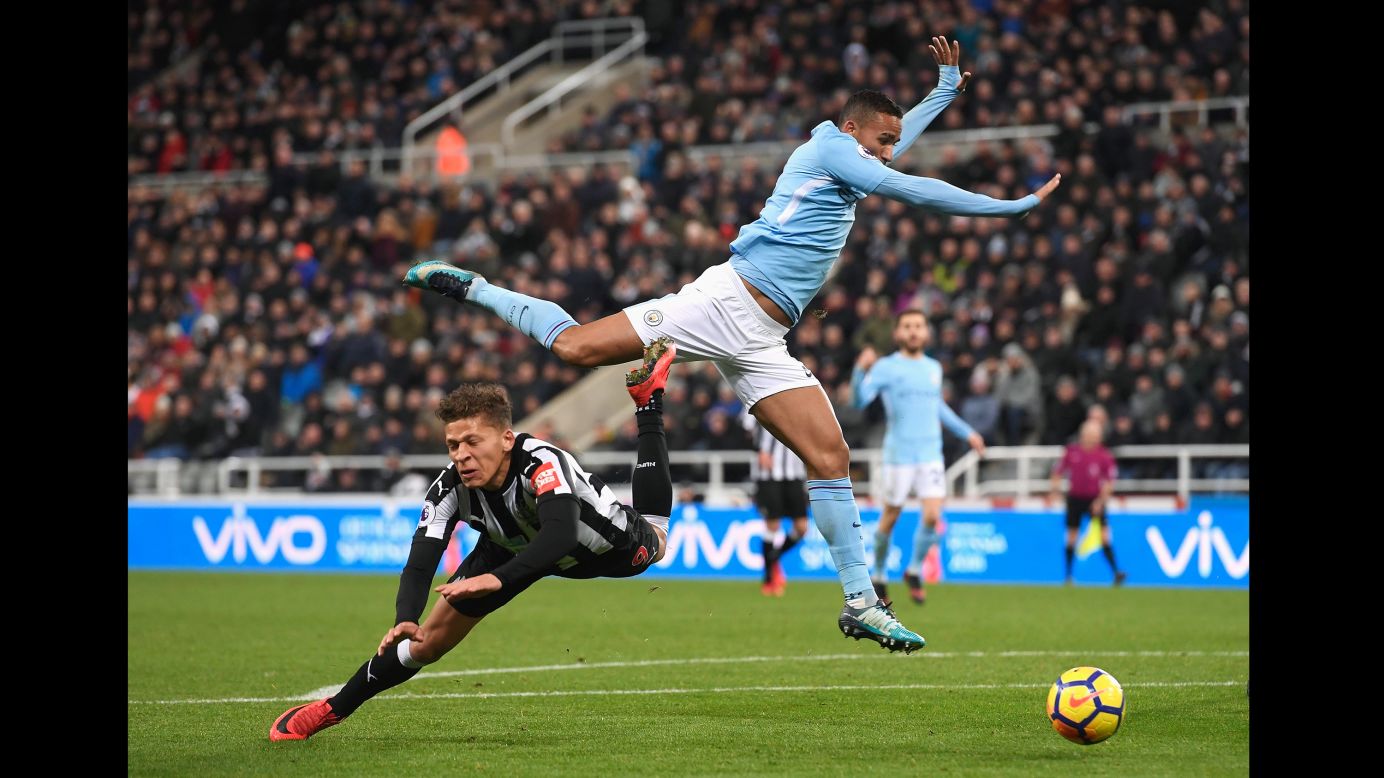 Newcastle striker Dwight Gayle falls to the ground after being challenged by Manchester City fullback Danilo during a Premier League match in Newcastle upon Tyne, England, on Wednesday, December 27. Gayle received a yellow card for diving.