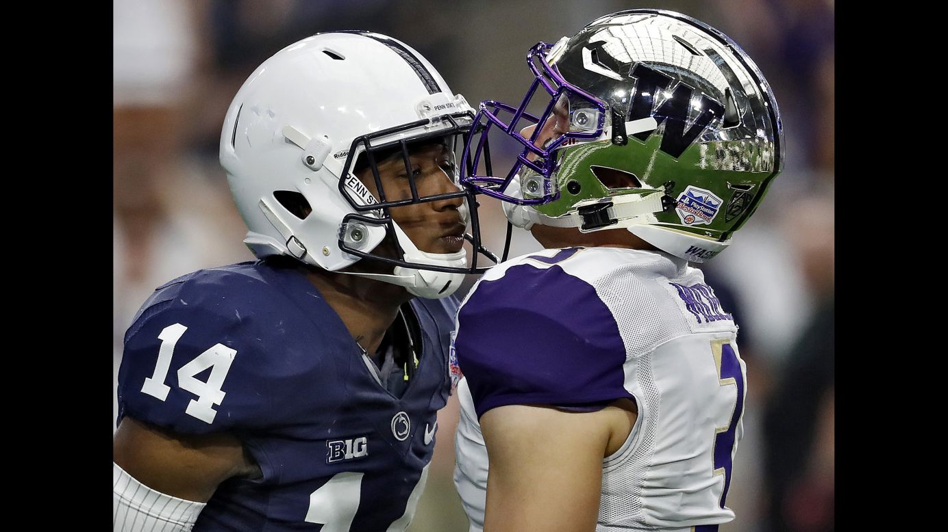 Penn State cornerback Zech McPhearson, left, and Washington quarterback Jake Browning exchange words during the first half of the Fiesta Bowl on Saturday, December 30.