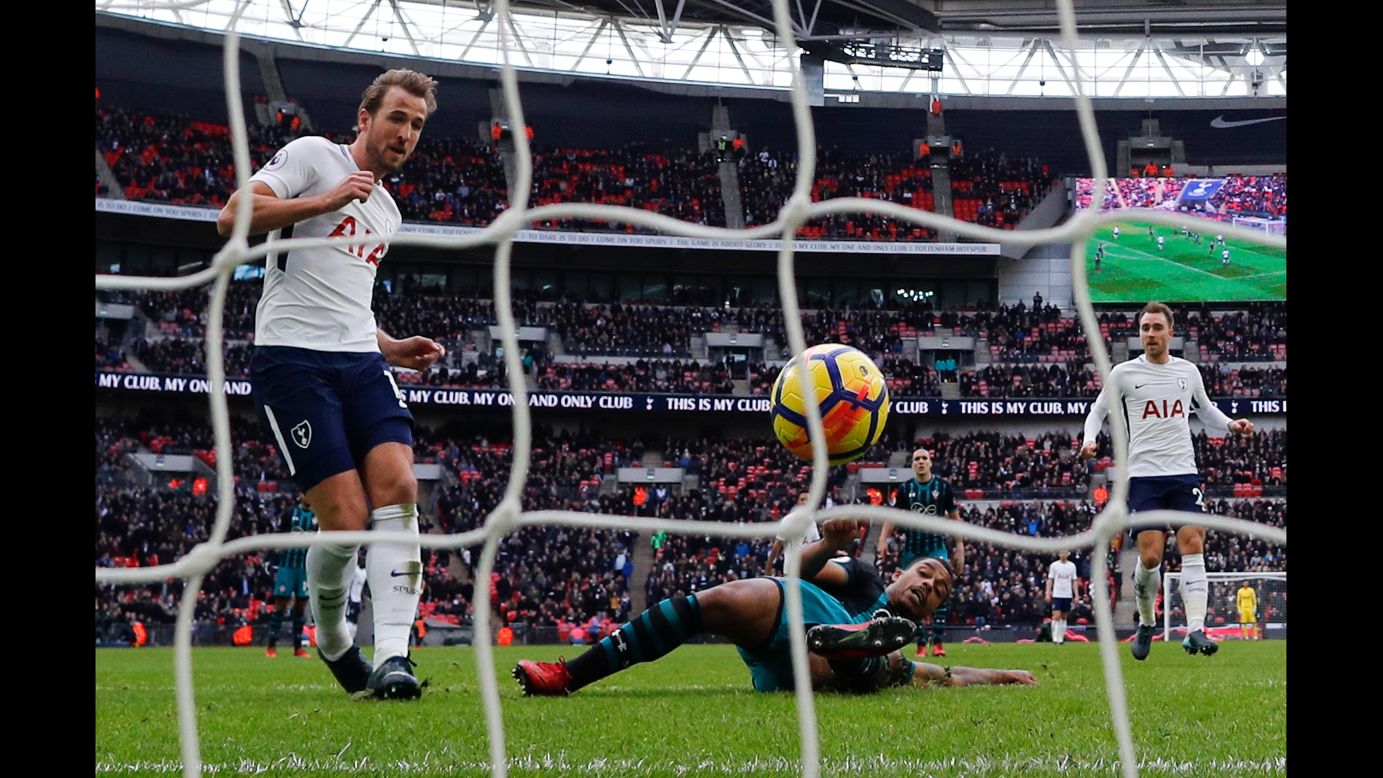 Tottenham striker Harry Kane, left, scores his second of three goals during a Premier League match in London on Tuesday, December 26. Tottenham defeated Southampton 5-3, and Kane broke the league record for most goals scored in a calendar year (39). 