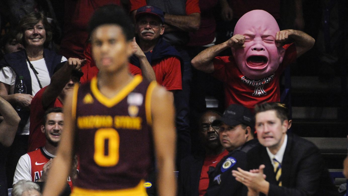 An Arizona basketball fan wears a baby mask during a college basketball game on Saturday, December 30.