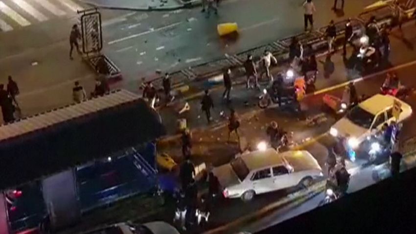 An image grab taken from a handout video released by Iran's Mehr News agency reportedly shows a group of men pushing traffic barriers in a street in Tehran on December 30, 2017.
Ten people died overnight in fresh unrest in Iran, local media reported on January 1, 2018, despite President Hassan Rouhani calling for calm and vowing more "space for criticism" in a bid to head off days of protest. / AFP PHOTO / MEHR NEWS / Handout / RESTRICTED TO EDITORIAL USE - MANDATORY CREDIT "AFP PHOTO / HO / MEHR NEWS" - NO MARKETING NO ADVERTISING CAMPAIGNS - DISTRIBUTED AS A SERVICE TO CLIENTS 
NO RESALE - NO BBC PERSIAN / NO VOA PERSIAN / NO MANOTO TVHANDOUT/AFP/Getty Images