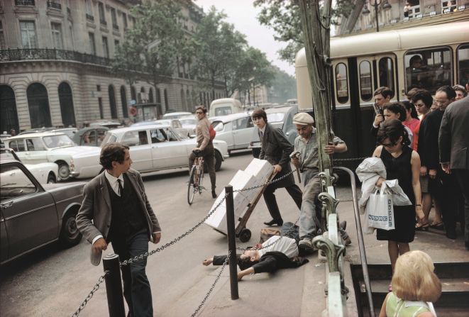 Meyerowitz favored his home turf of Fifth Avenue, New York, but one of his best shots was taken in Paris. "Which is the greater drama of life in the city: the fictitious clash between two figures that is implied (by the young man on the ground and the workman stepping over him), or the indifference of the one to the other that is actual? A photograph allows such contradictions to exist in everyday life; more than that, it encourages them," he said.