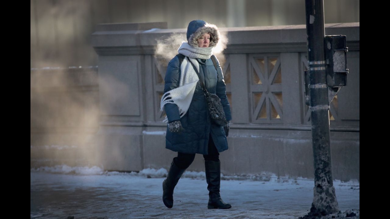 A woman in Chicago walks to work in sub-zero temperatures on Tuesday, January 2.