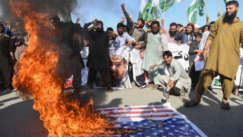 Activists burn the American flag at a protest in Karachi on Tuesday. 