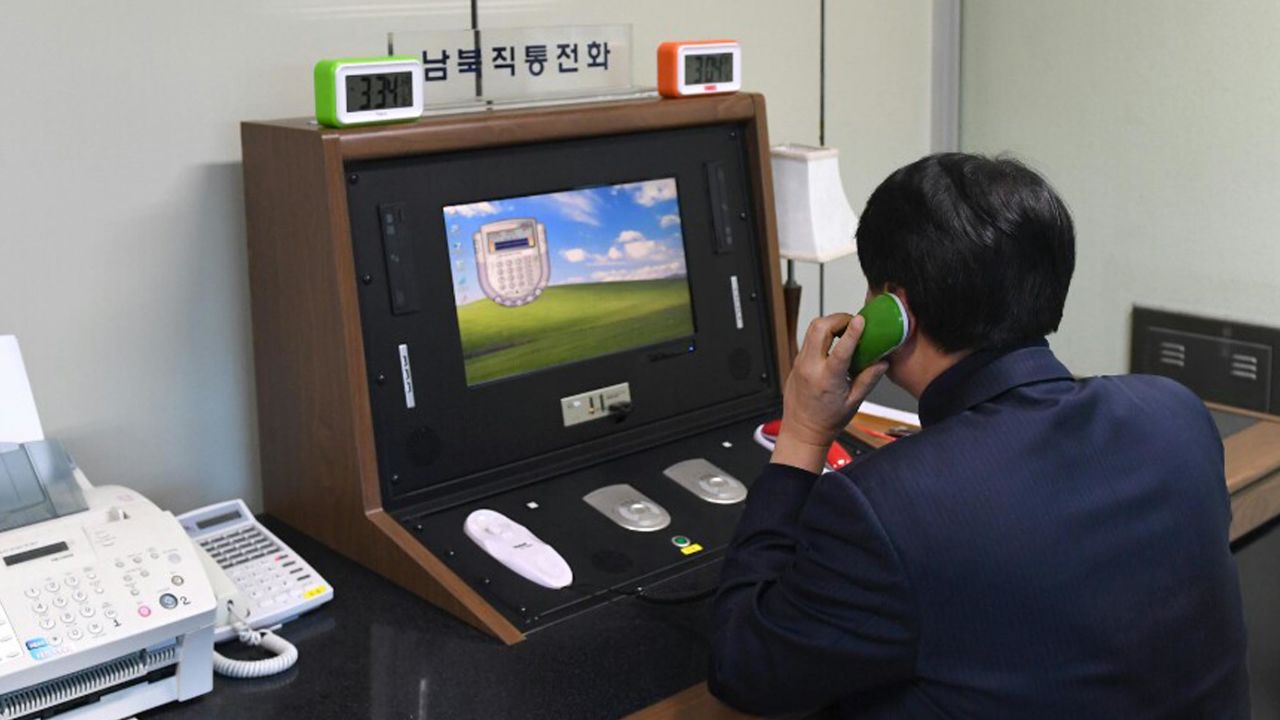 A South Korean official speaks with a North Korean officer on the hotline on Wednesday.