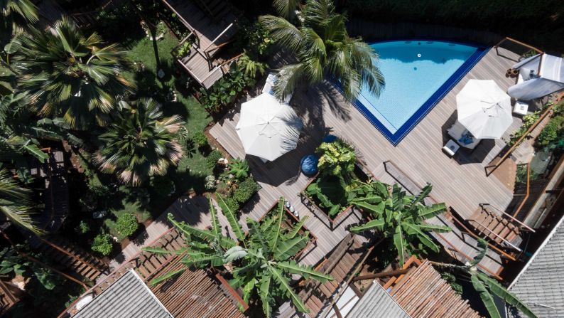 The eco-sensitive Ecopousada Teju-Açu welcomes guests with understated bungalows surrounding a lush pool area.