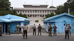 South Korea and US soldiers stand guard during a commemorative ceremony for the 64th anniversary of the signing of the Korean War Armistice Agreement at the truce village of Panmunjom in the Demilitarized Zone (DMZ) dividing the two Koreas on July 27, 2017.The armistice agreement on July 27, 1953 brought three years of active combat in the Korean War to a halt, but the two Koreas are still technically at war as no formal peace treaty was signed. / AFP PHOTO / POOL / JUNG YEON-JE        (Photo credit should read JUNG YEON-JE/AFP/Getty Images)