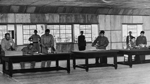 Lieutenant General William K Harrison and Senior Communist Delegate General Nam Il during the signing of the Korean Armistice in Panmunjom on July 27, 1953.