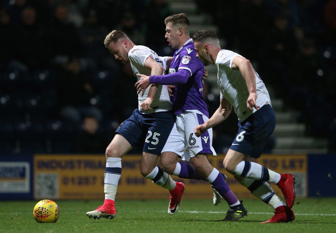 Kevin O'Connor (No. 25) playing for Preston against Bolton.