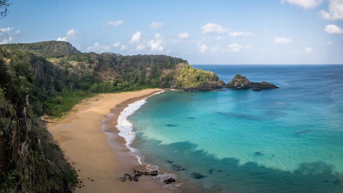 Atlantic rainforest borders the spectacular Praia do Sancho.