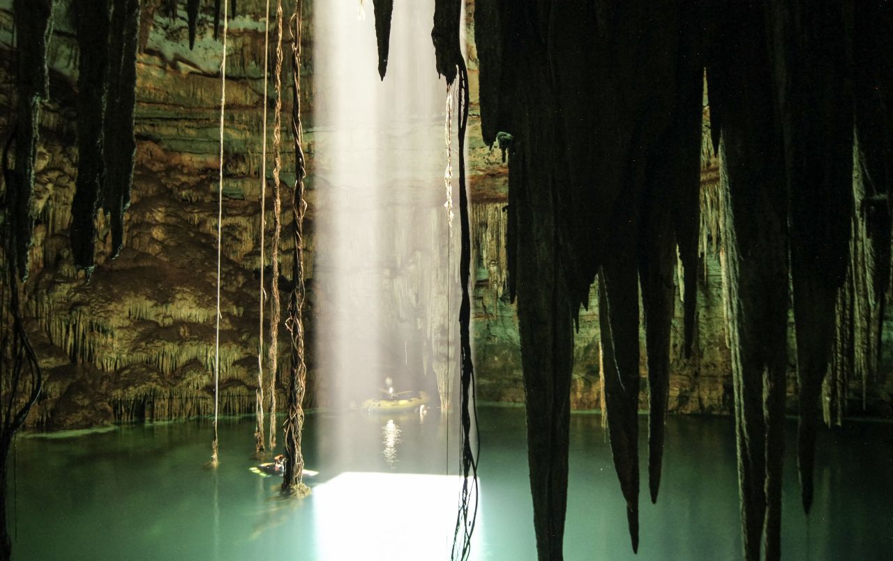 Water-filled caverns -- called cenotes -- sustained the Mayan civilization, and were central to its spiritual beliefs. Pictured, Holtun cenote in Chichen Itza.