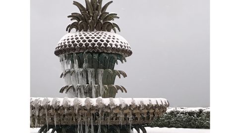 A metal pineapple tops a fountain in Charleston.