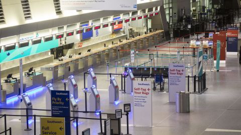 A check-in area stands empty at Boston's Logan International Airport on January 3. Thousands of flights have been canceled across the country.