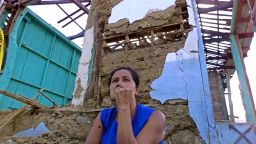 A woman sits before her earthquake-destroyed house January 29, 2001 in Armenia, El Salvador,  40kms (26 miles) west of San Salvador.  