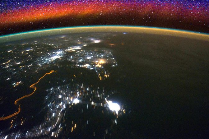 Bright swaths of red in the upper atmosphere, known as airglow, can be seen in this image from the International Space Station. NASA's <a href="index.php?page=&url=https%3A%2F%2Fedition.cnn.com%2F2019%2F10%2F10%2Fworld%2Fnasa-icon-mission-launch-scn%2Findex.html" target="_blank">ICON mission</a>, launched last year, will observe how interactions between terrestrial weather and a layer of charged particles called the ionosphere create the colorful glow.