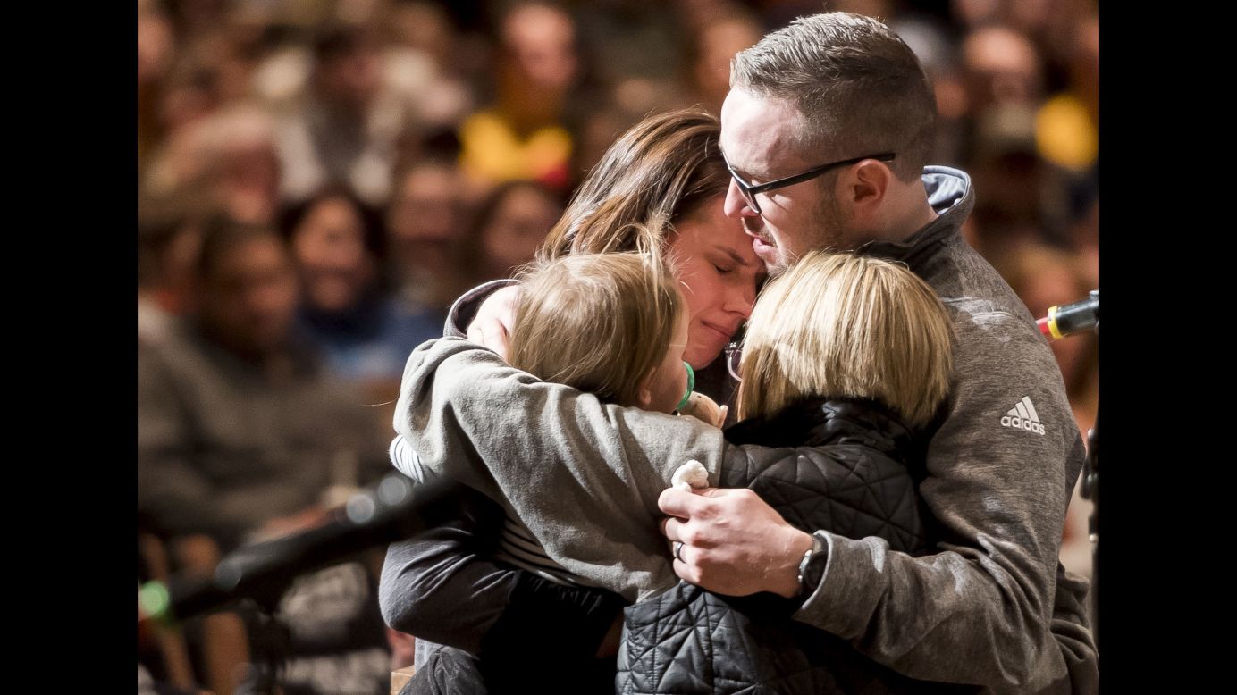 Gracie Parrish, back left, is embraced by loved ones as she attends <a href="http://www.cnn.com/2018/01/02/us/colorado-slain-deputy-remembered/index.html" target="_blank">a candlelight vigil</a> for her late husband, Zackari, on Monday, January 1. Zackari Parrish, a 29-year-old sheriff's deputy, was fatally shot by Matthew Riehl, who opened fire on Parrish and other deputies responding to a call at Riehl's apartment in Highlands Ranch, Colorado. Riehl was killed in a shootout with police.