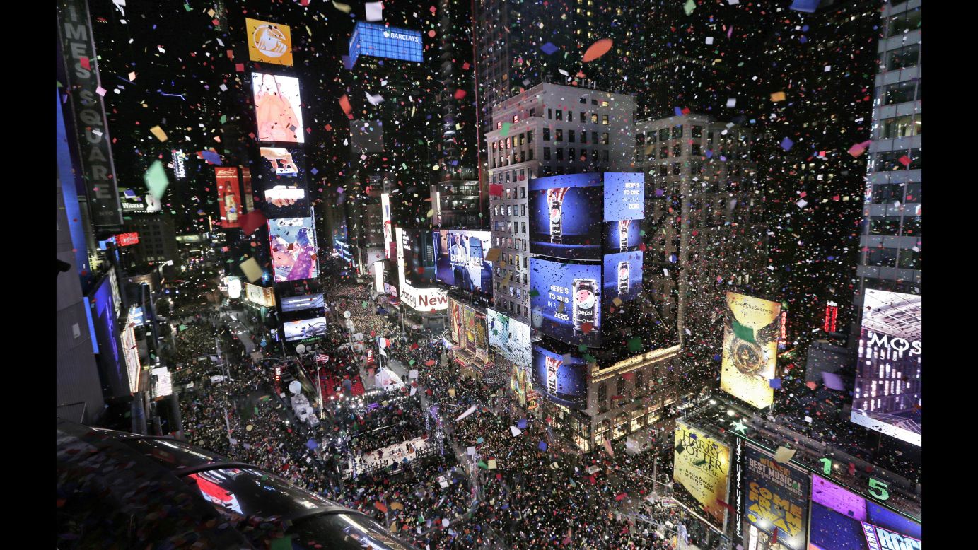 Confetti drops over the crowd in New York's Times Square as the clock strikes midnight on Monday, January 1. <a href="http://www.cnn.com/2017/12/31/world/gallery/2018-new-year/index.html" target="_blank">See New Year's celebrations from around the world</a>