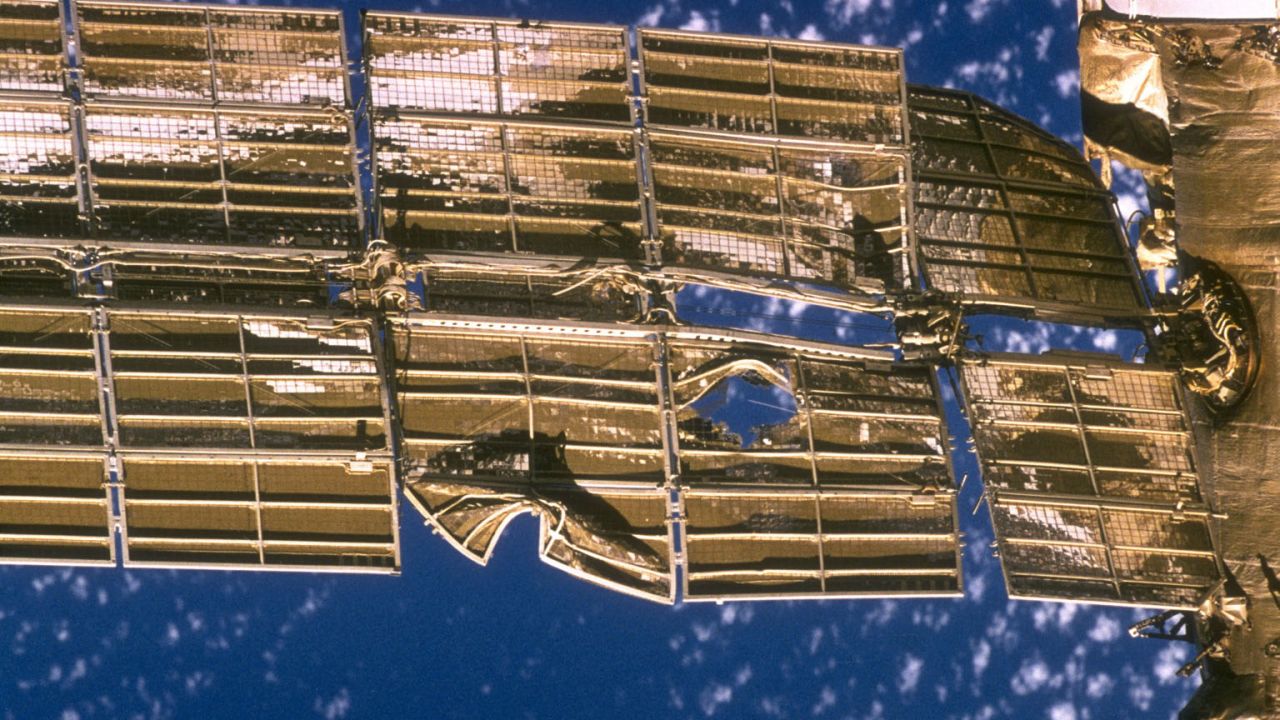 A close-up view of the solar array panel on Russia's Mir space station shows damage incurred by the impact in 1997 of a Russian unmanned resupply ship.