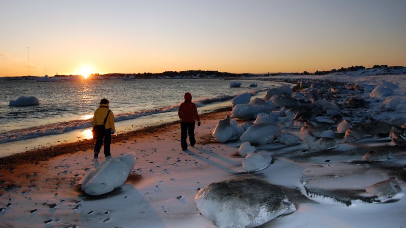 <strong>Thawing out: </strong>Huge balls of ice wash up on the beach as the frozen sea melts. 