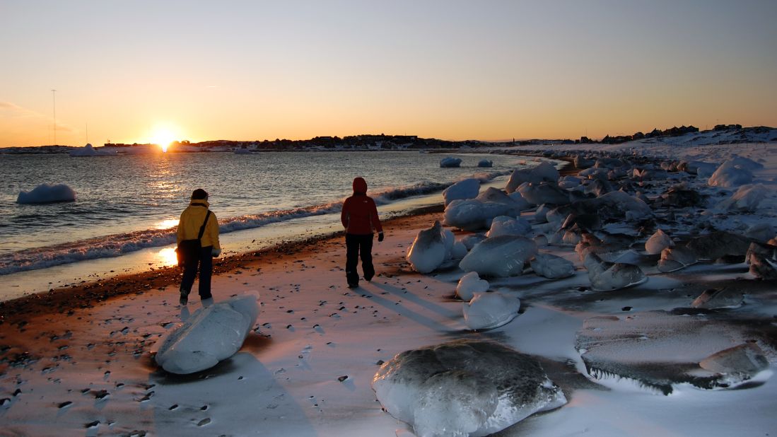 <strong>Thawing out: </strong>Huge balls of ice wash up on the beach as the frozen sea melts. 