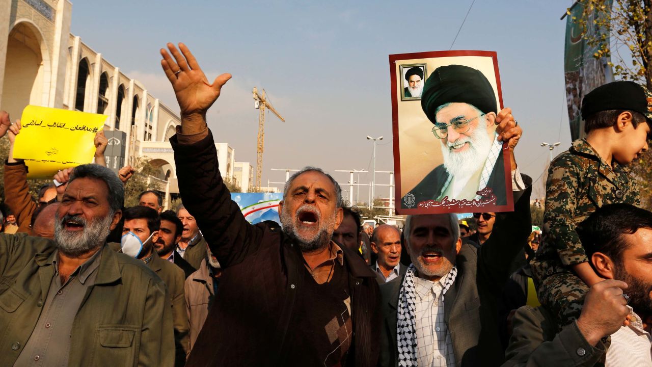 Government supporters march following prayers Friday in Tehran.