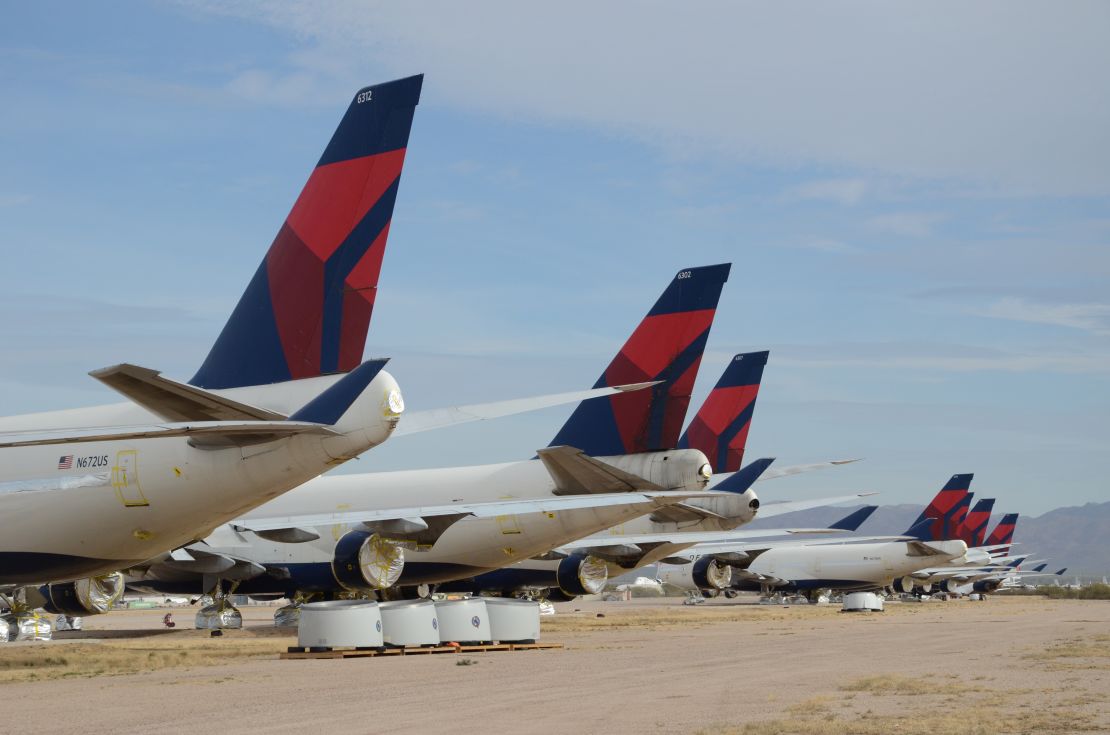 Delta Air Lines Boeing 747-400s sit in the desert awaiting their fate after being retired from the airline's fleet.