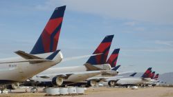Delta Air Lines Boeing 747-400s sit in the desert awaiting their fate after being retired from the airline's fleet.