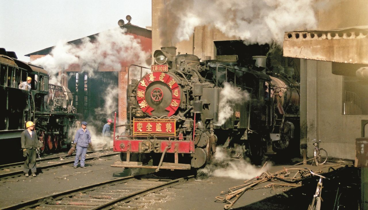 <strong>Visits to China</strong>: It was in the early 1990s that Kitching first heard stories of China's stunning steam trains: "I resolved to join a tour as soon as possible," he says. This 1992 photograph shows the Sujitan industrial locomotive works overhauling locomotives for a wide range of mines, steelworks and quarries.