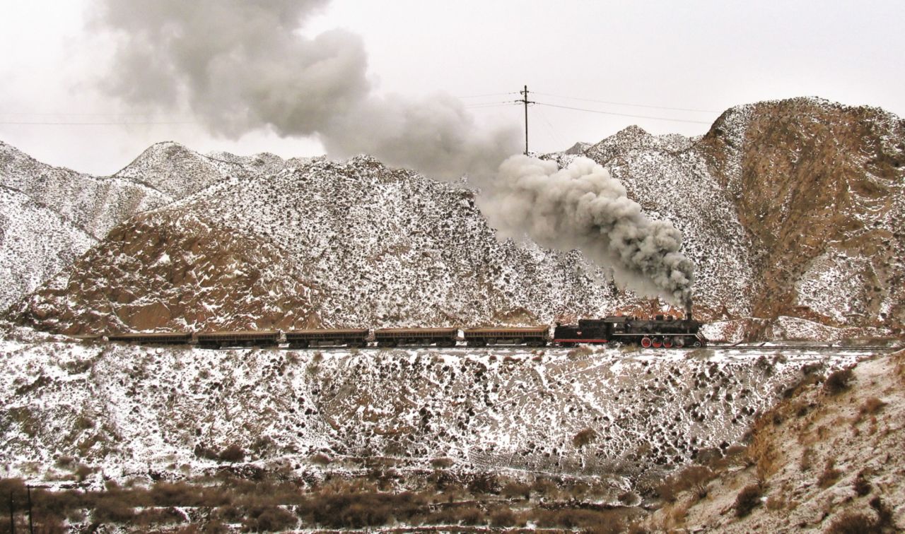<strong>Touring the country: </strong>Kitching first traveled to China as part of an organized tour -- later, he coordinated freelance visits and traveled with friends or his son. This 2006 photograph depicts a train traveling uphill on the Baiyin Mining Railway.